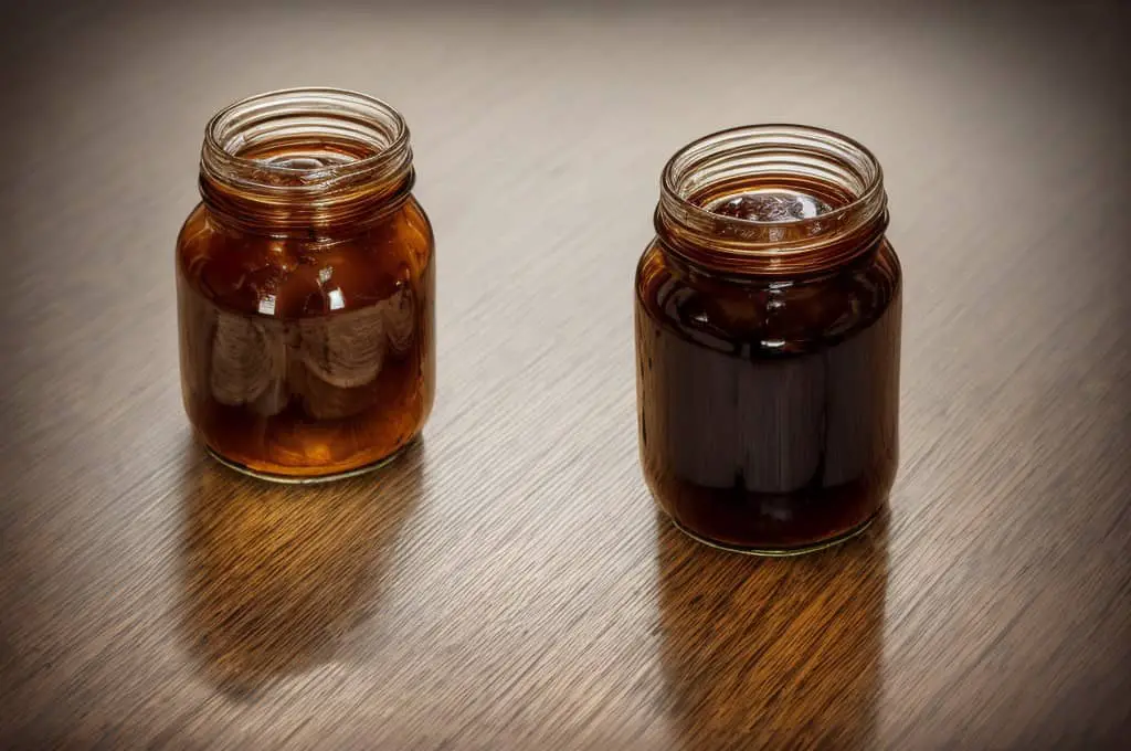 light and dark sorghum syrup in jars