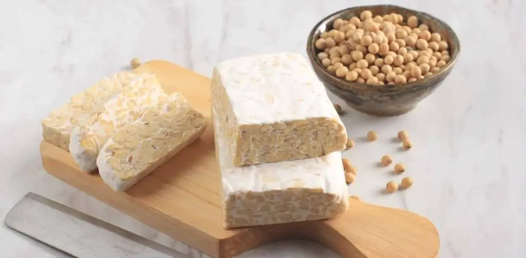 raw tempeh slices on cutting board